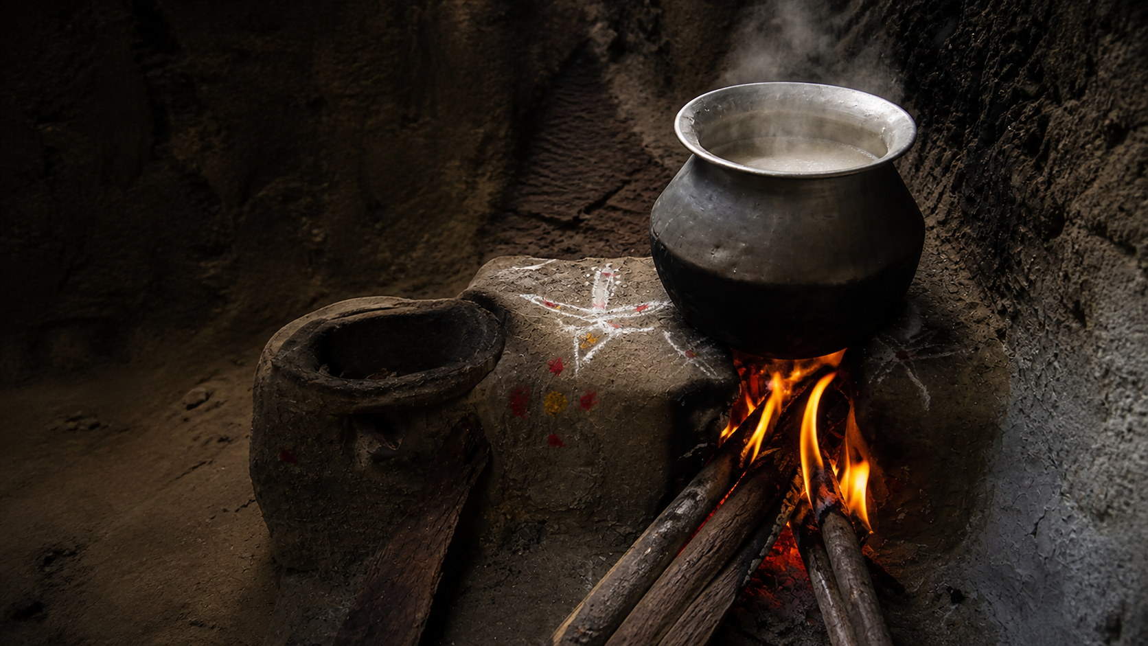 Traditional wood-fired daure chulo with a cooking pot